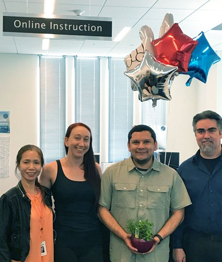 David Vasquez, Instructional Associate Online Instruction and co-workers